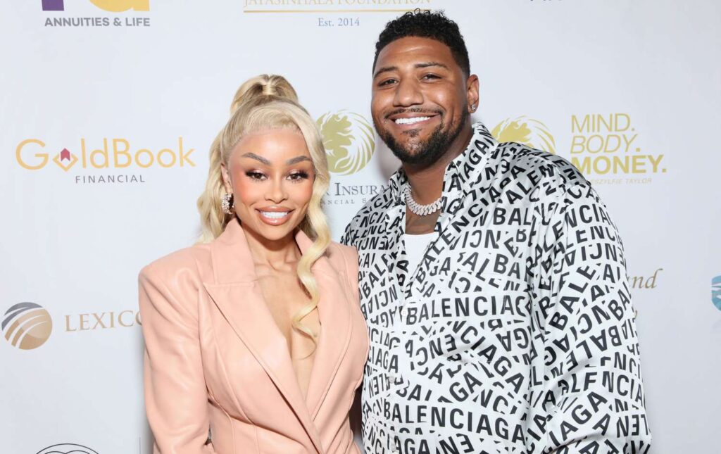 Derrick-Milano-Blac-Chyna-101924-4-6fe410d8d00f4f21a283f397befa53e8 Blac Chyna and Derrick Milano smiling together on the red carpet at a 2024 public event.