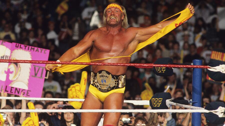 Hulk_Hogan_Bio Young Hulk Hogan flexing in the wrestling ring with the WWF Championship belt around his waist
