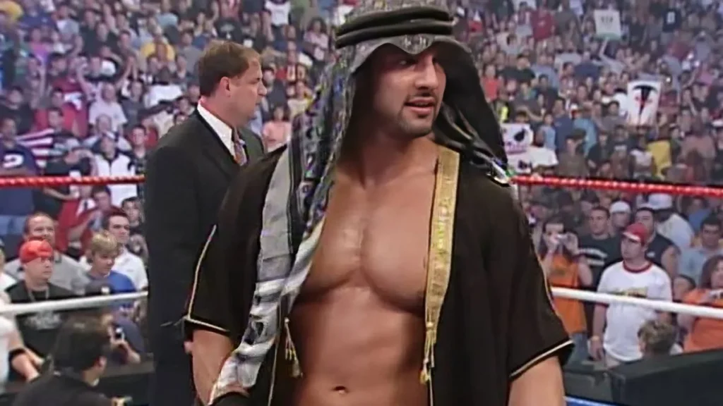 Muhammad-Hassan-WWE Muhammad Hassan WWE character in hooded robe entrance gear during controversial 2004-2005 storyline period